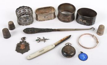 Various silver items, including four napkin rings, St Christpher enamel pendant, fruit knife