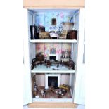 An unusual early English painted wooden dolls cupboard and contents,
