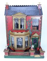 ‘Ivy Villa’ a painted wooden dolls house and contents, English circa 1890,