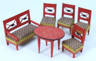 Suite of red painted Empire style wooden chairs and table, German mid 19th century,