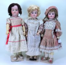 A.M ‘Floradora’ bisque head girl doll and two others, German circa 1915,
