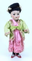 A Simon & Halbig 1199 bisque head oriental doll in original clothes, German circa 1905,
