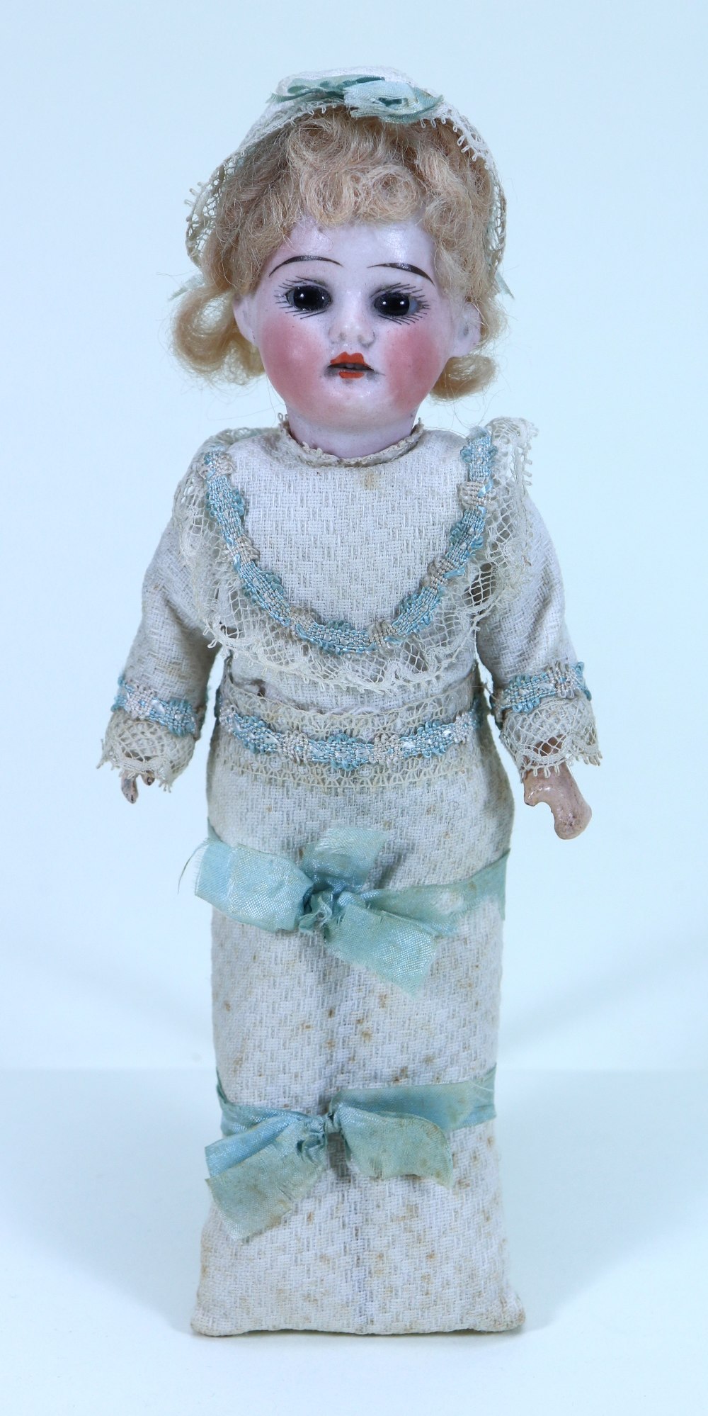An all original A.M bisque head doll in papoose, German circa 1910,