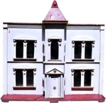 A large G&J Lines Bros painted wooden dolls house with lift, English circa 1900,