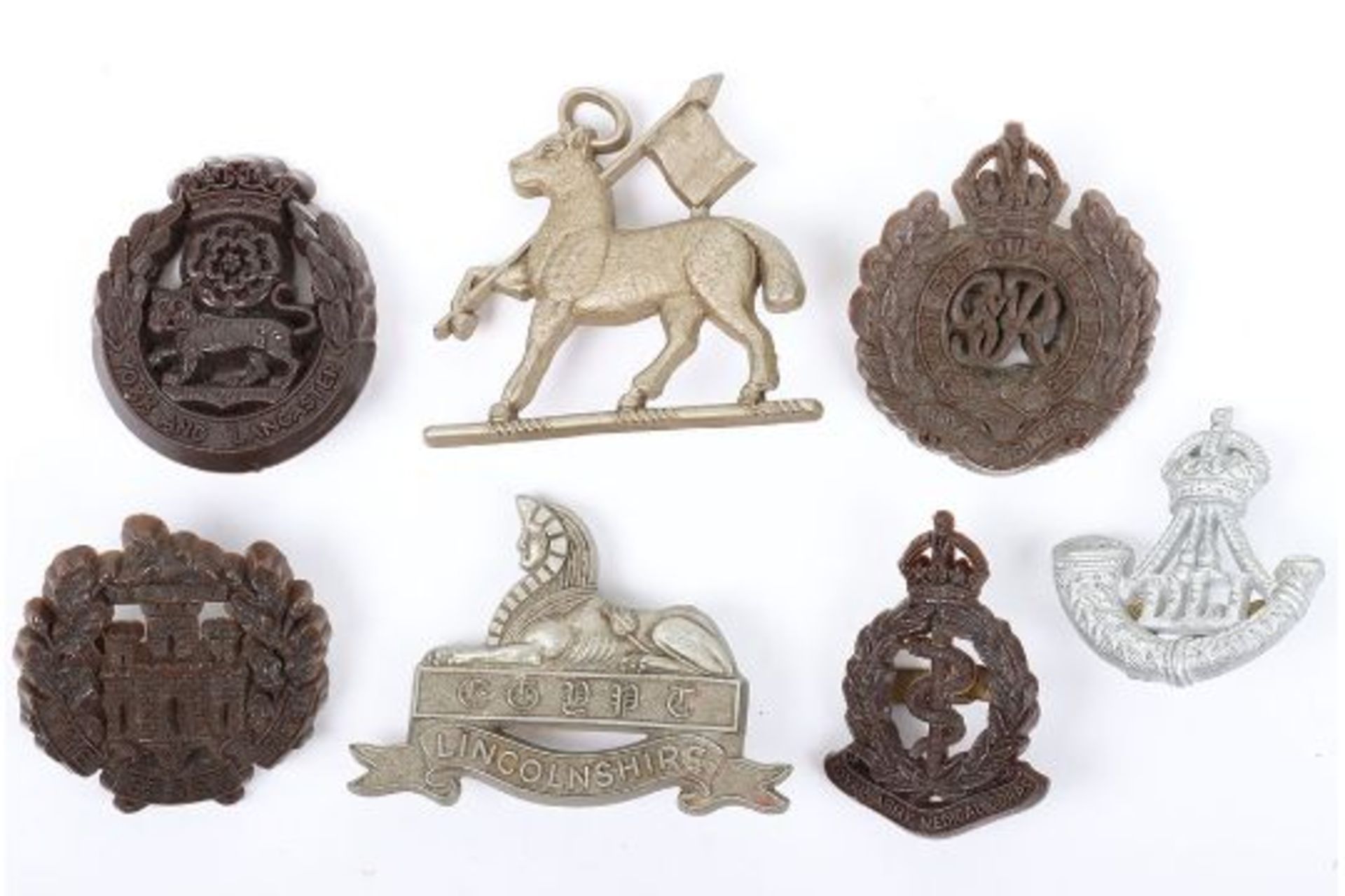 7x WW2 British War Economy Plastic Cap Badges