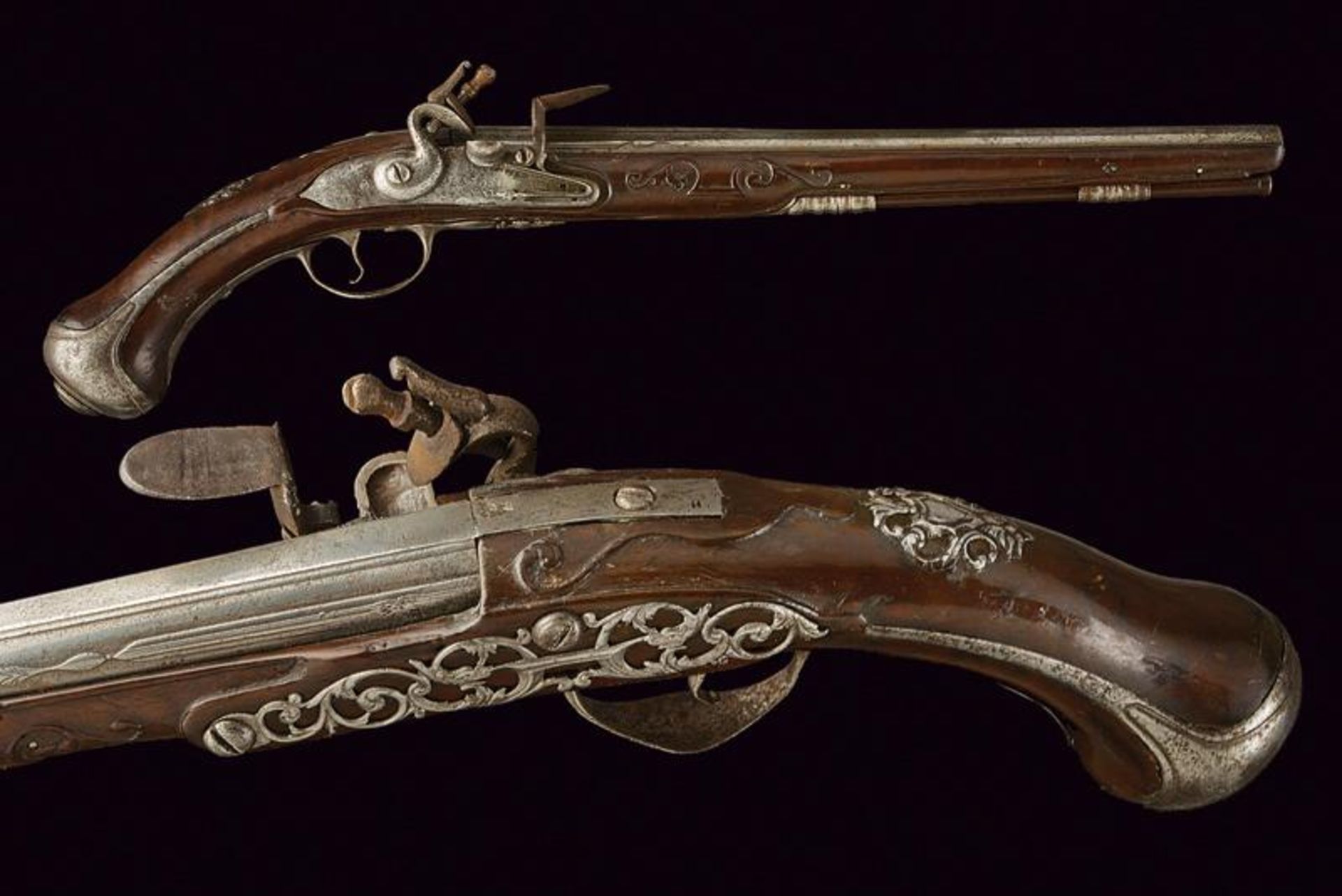 A rare and interesting flintlock pistol of the Magazin Royal signed Thomas