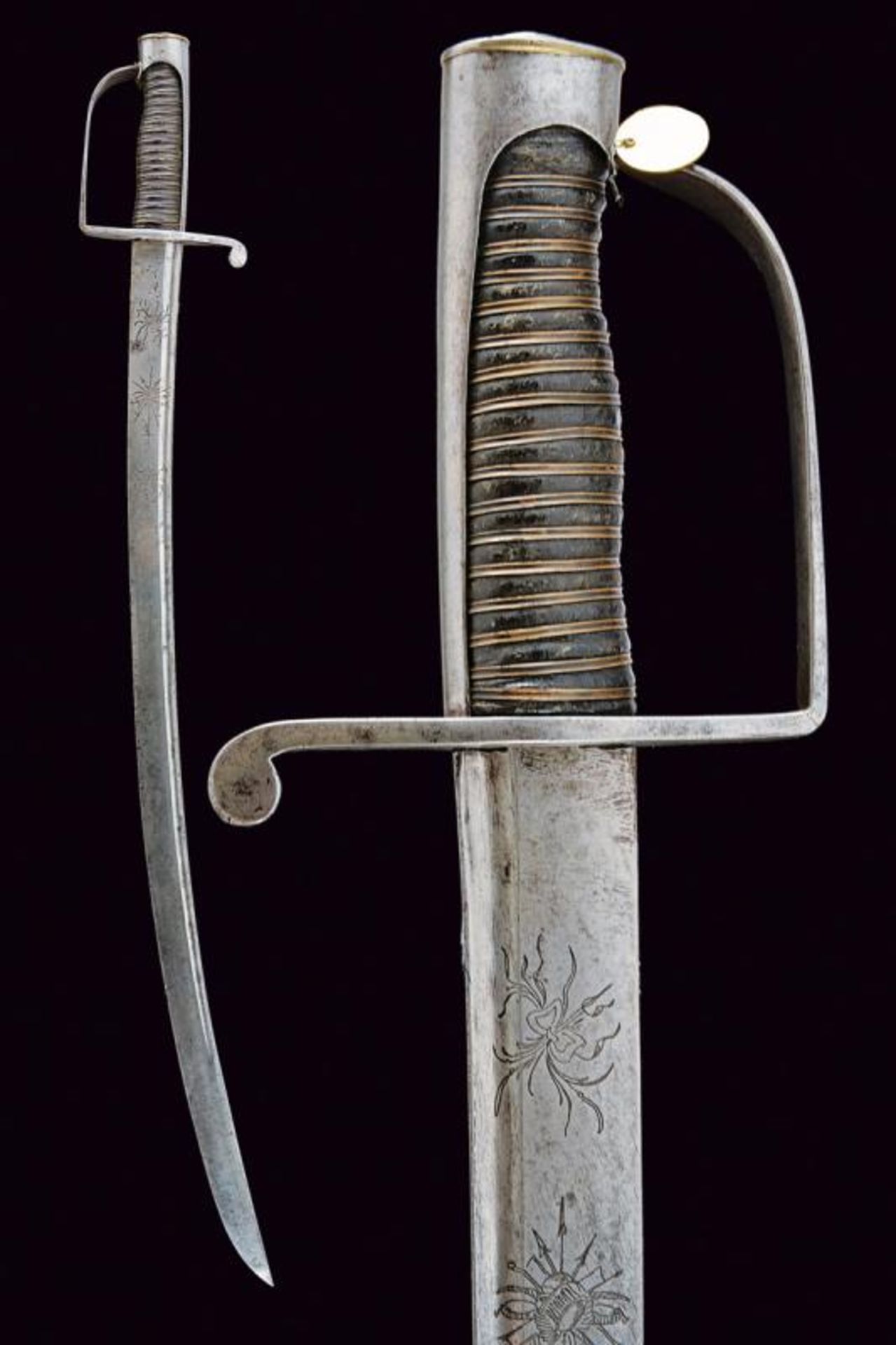 A sabre with engraved blade