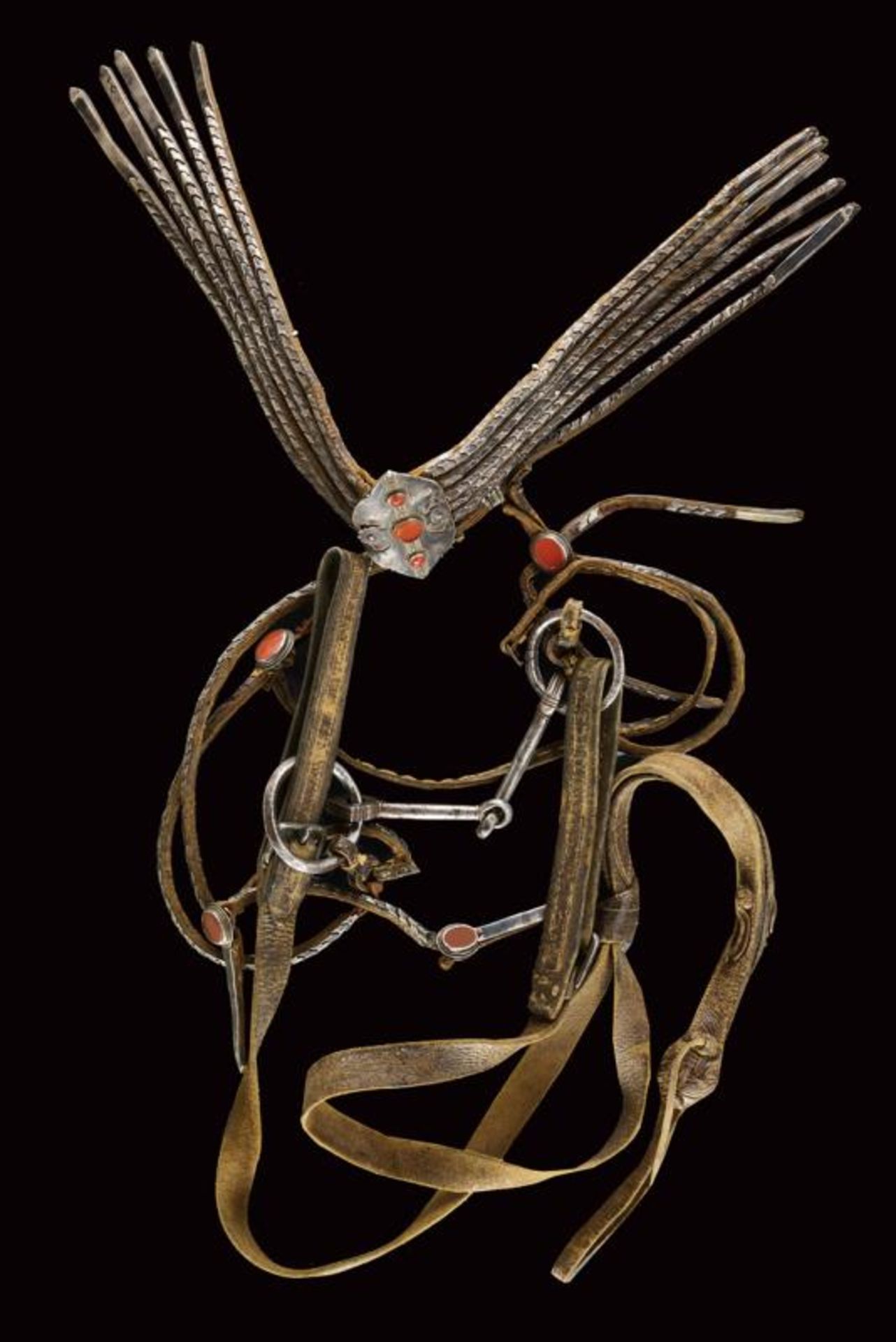 A snaffle with bridle and reins