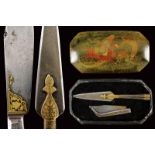 A set of a folding knife and a spearhead in a painted case