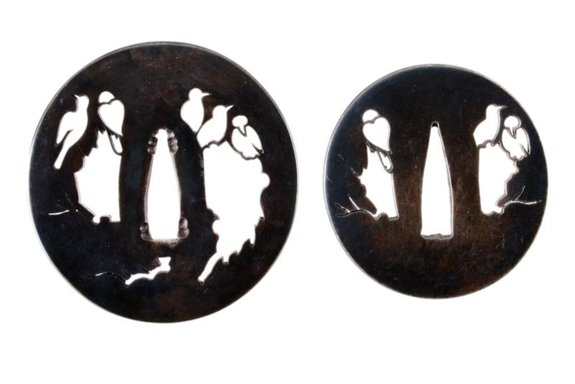 A pair of iron patinated daisho tsuba