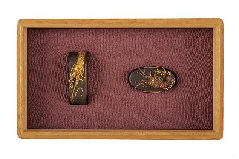 A fuchi and kashira with signature