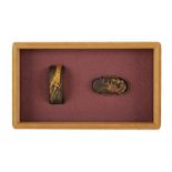 A fuchi and kashira with signature