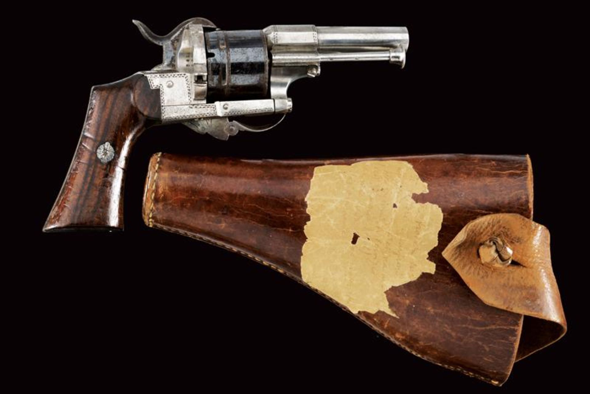 A Lefaucheux pin-fire revolver kept in leather holster