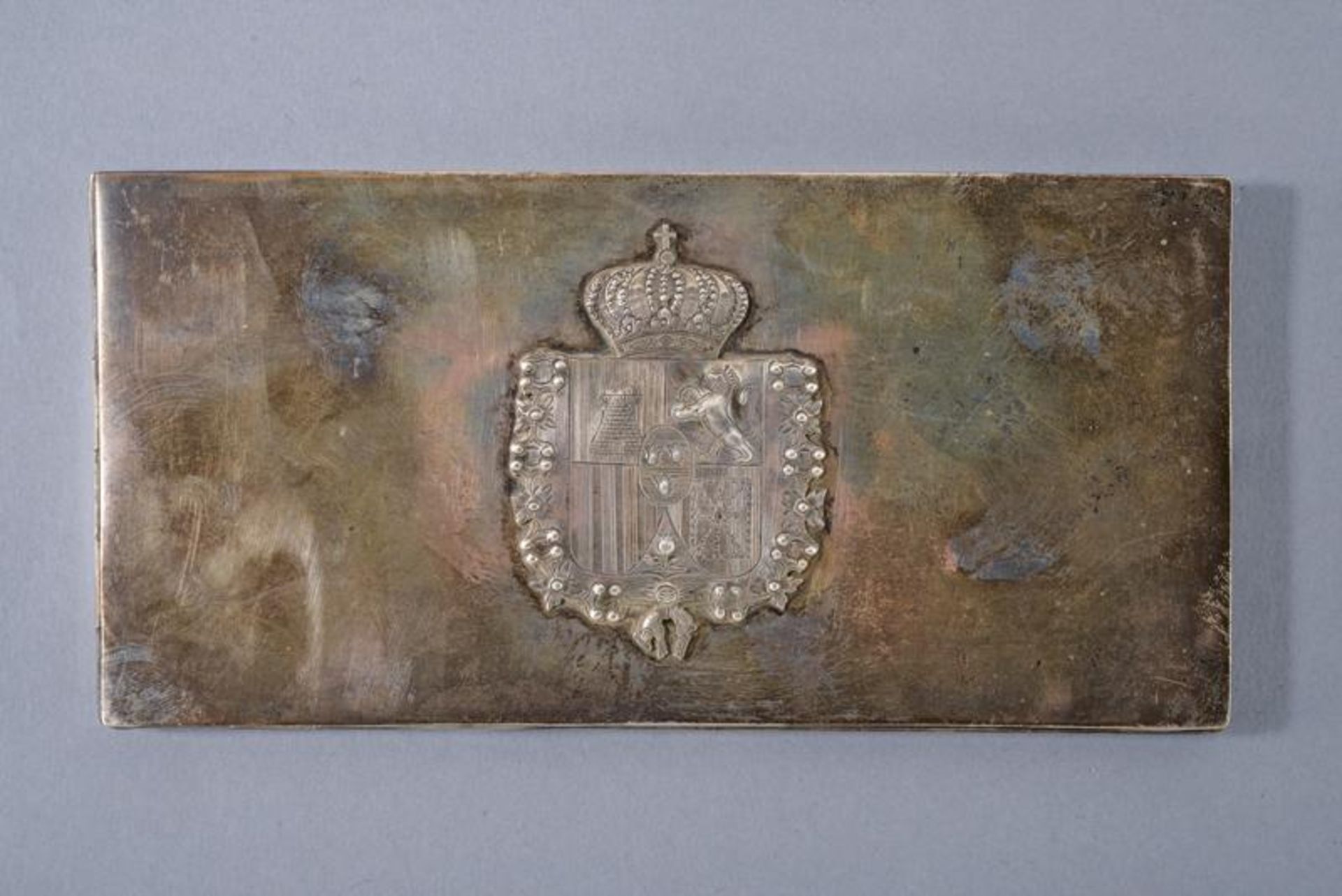A silver cigarette case with royal spanish coat of arms