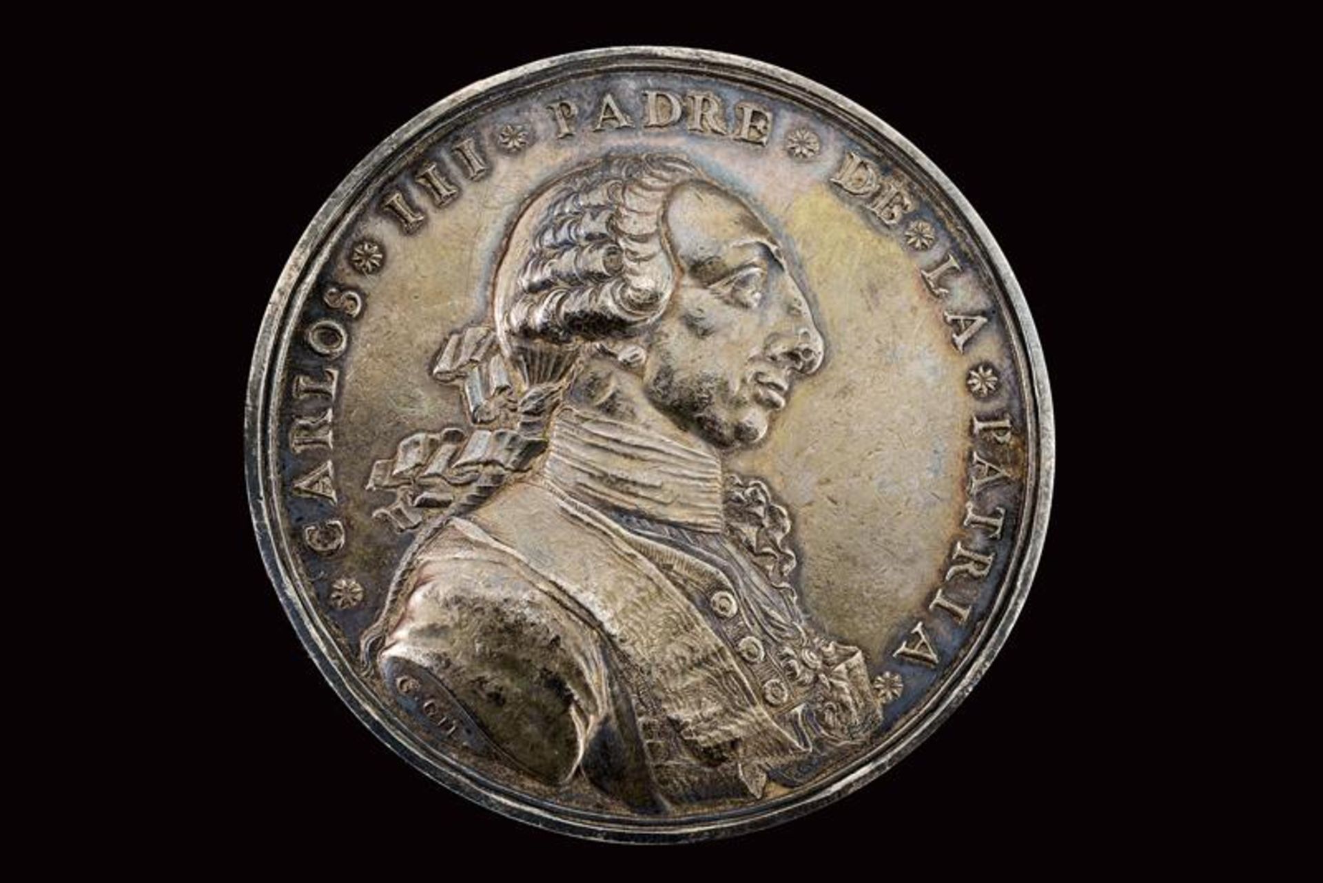 A silver Carlos III medal