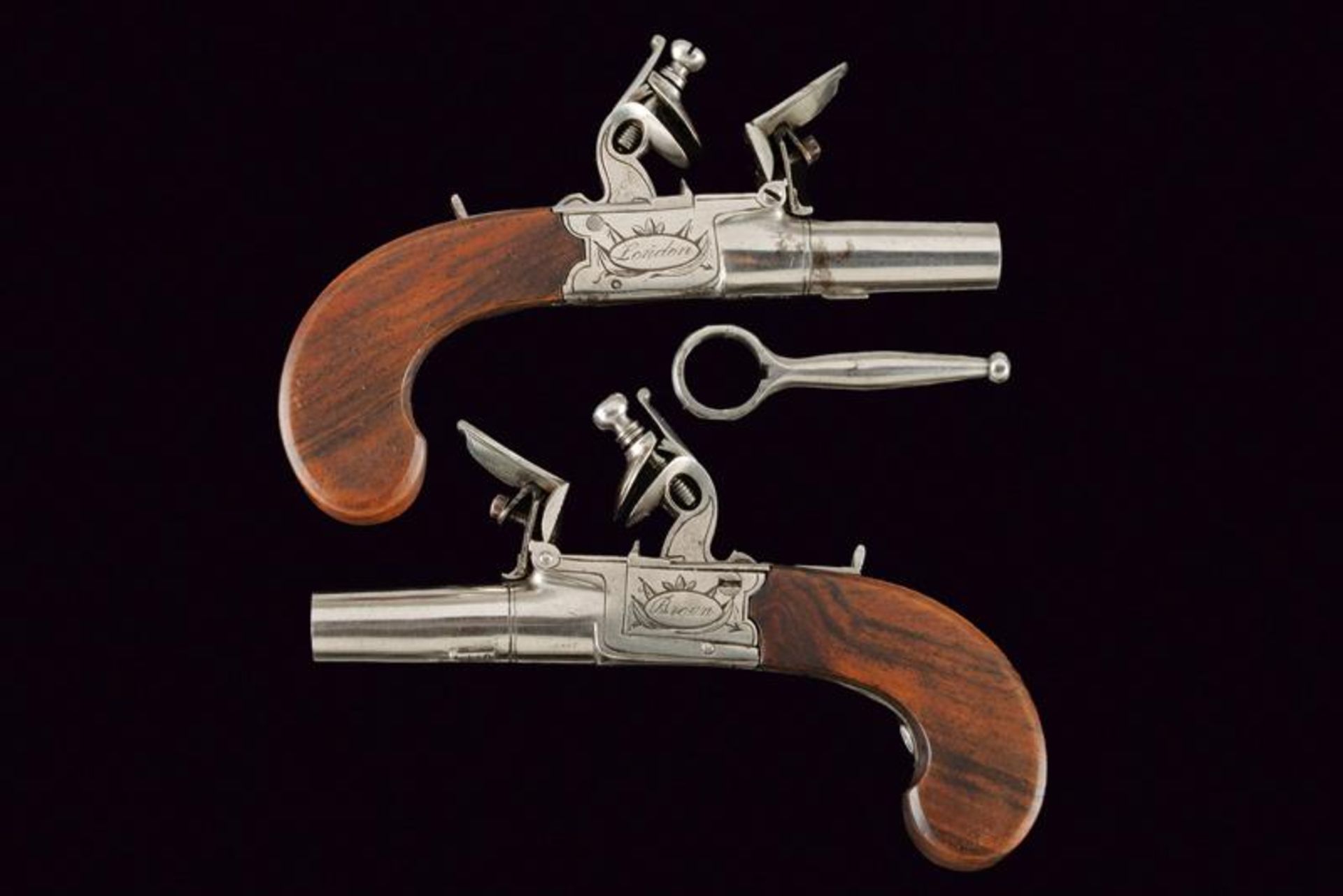 A small pair of flintlock pocket pistols by Brown