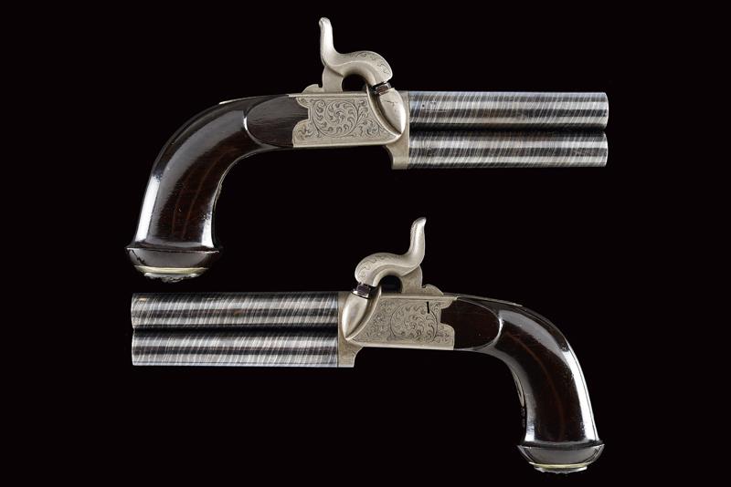 An elegant and rare pair of over-and-under barreled percussion pocket pistols