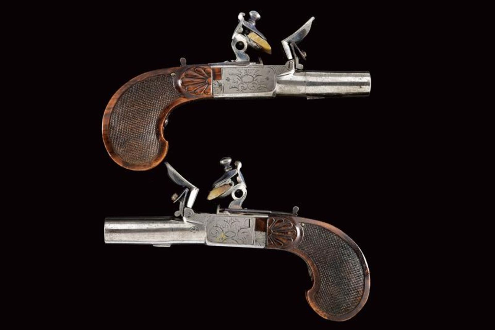 A fine pair of flintlock pocket pistols in first Empire Style