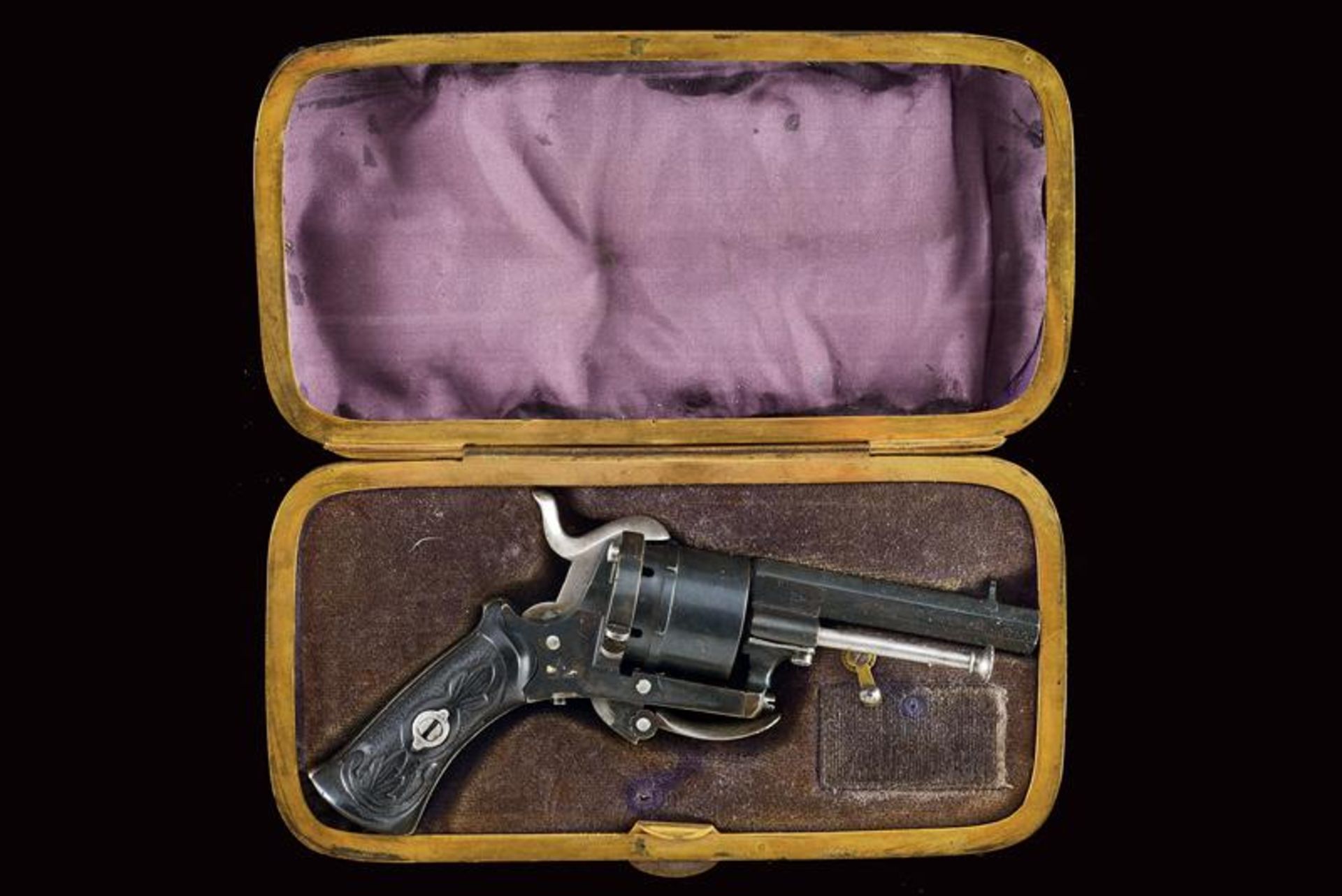 A cased pin-fire revolver