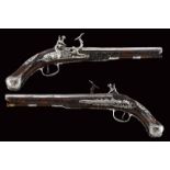 A beautiful pair of snaphaunce lock pistols signed by master G.G.