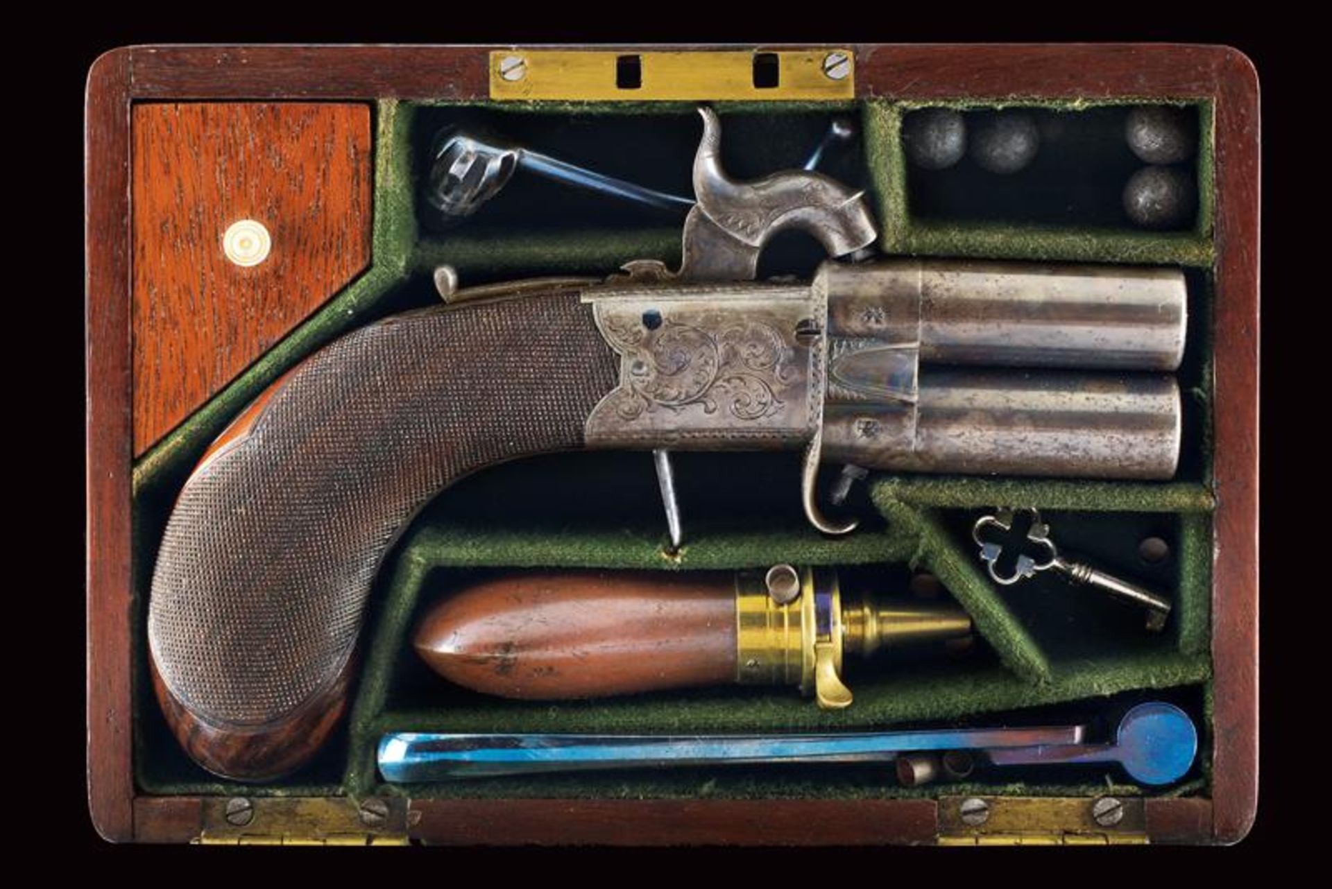 A cased over-and under-barreled percussion pistol by W. Richards