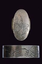 A Fuchi-kashira signed Ishiguro Masayoshi with kao