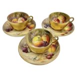 Set of three early 20th century Royal Worcester tea cups and saucers decorated by William Ricketts