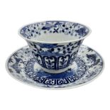 18th century Chinese blue and white Kangxi tea bowl and saucer decorated with rockwork and peonies w