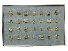 Twenty-eight cap badges for Hussars