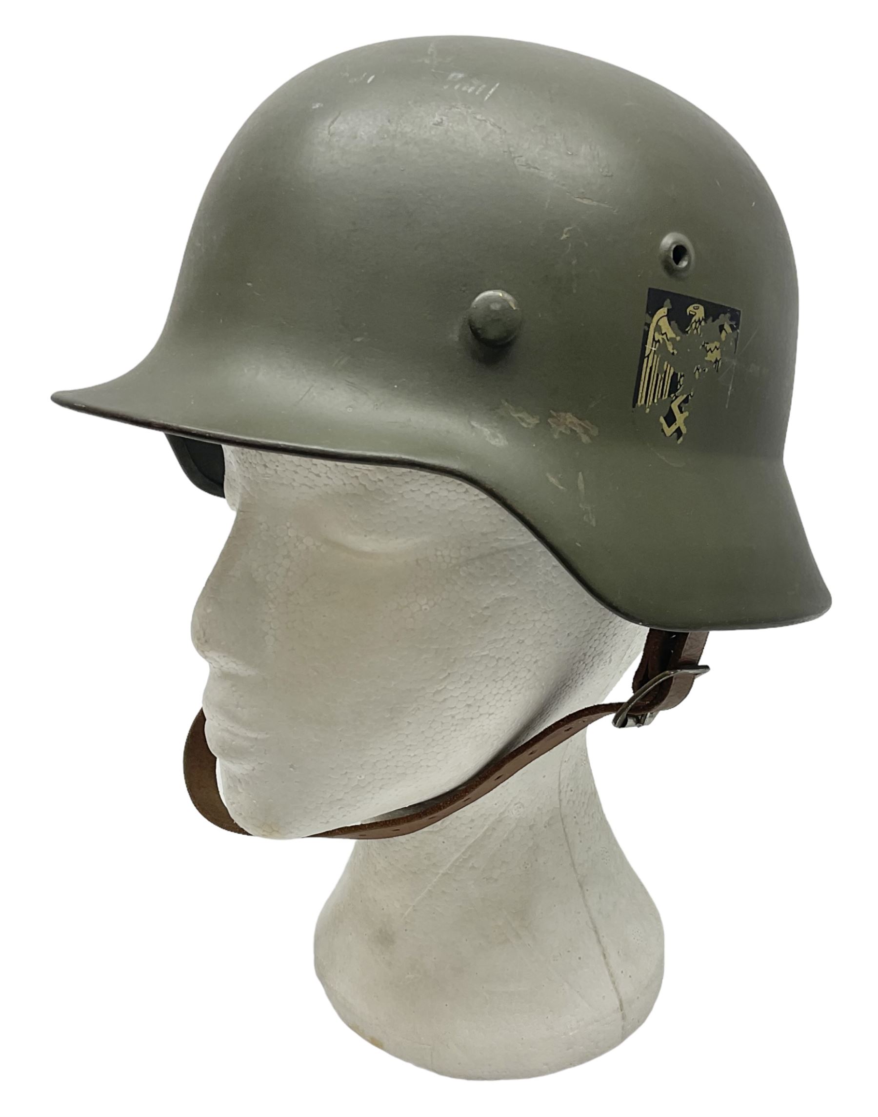 German M35 style steel helmet marked ET60 to the side skirt and 4197 to the back apron