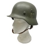 German M35 style steel helmet marked ET60 to the side skirt and 4197 to the back apron
