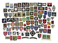 Approximately one-hundred printed and embroidered cloth badges including Royal Tank Regiment