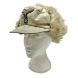 WW2 German Luftwaffe winter or Eastern Front fur cap with fold-down ear covers; cloth eagle and roun