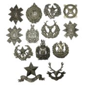 Thirteen Scottish metal Glengarry badges including Black Watch