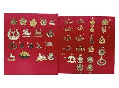 Forty glengarry and cap badges and shoulder titles including Gordon Highlanders