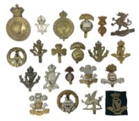 Fourteen cap badges of Irish interest including Royal Dublin Fusiliers inscribed to the slider 'From