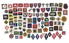 Approximately one-hundred printed and embroidered cloth badges including I