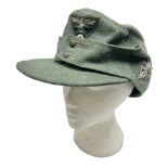 WW2 German Army M43 field cap with triangular cloth eagle and roundel badge and metal edelweiss badg