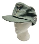 WW2 German Army M43 field cap with triangular cloth eagle and roundel badge and metal edelweiss badg
