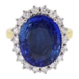 18ct gold oval unheated sapphire and round brilliant cut diamond cluster ring