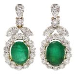 Pair of 18ct gold oval emerald and round brilliant cut diamond pendant stud earrings