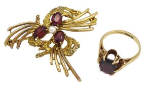 Gold three stone garnet and pearl abstract brooch by Cropp & Farr and a gold single stone oval garne