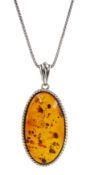 Silver oval Baltic amber pendant necklace