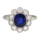 Palladium and platinum milgrain set oval sapphire and diamond cluster ring