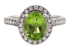 Silver oval peridot and cubic zirconia cluster ring