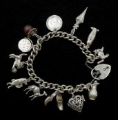 Silver charm bracelet with heart padlock clasp and twelve silver charms including cat