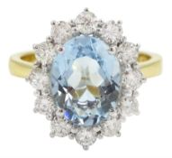 18ct gold oval aquamarine and round brilliant cut diamond cluster ring