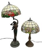 Tiffany style lamp in the form of a semi nude woman holding up a leaded lampshade together with a si