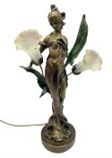 Art Nouveau style lamp in the from of a woman with two foliate lampshades