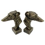 Pair of bronzed cast iron greyhound busts on plinths